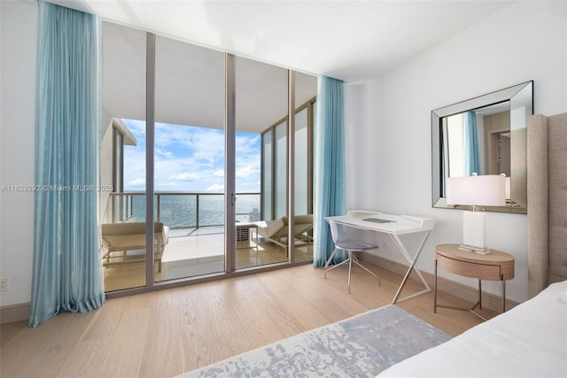 9703 Collins Ave Unit Ph-12, Bal Harbour, FL 33154 - bedroom with access to outside, wood finished floors, and a wall of windows