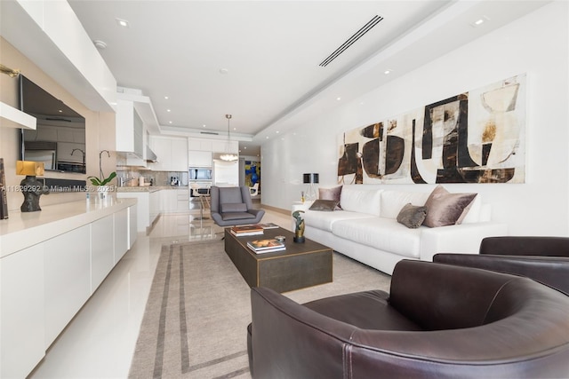 9703 Collins Ave Unit Ph-12, Bal Harbour, FL 33154 - living area featuring a raised ceiling and recessed lighting
