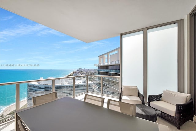 9703 Collins Ave Unit Ph-12, Bal Harbour, FL 33154 - balcony featuring a water view and outdoor dining space
