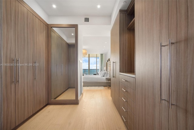 9703 Collins Ave Unit Ph-12, Bal Harbour, FL 33154 - walk in closet with light wood finished floors