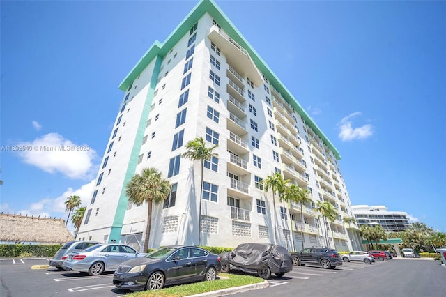 10350 W Bay Harbor Dr Unit 8F, Bay Harbor Islands, FL 33154 - view of apartment building / complex featuring uncovered parking