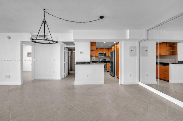 10350 W Bay Harbor Dr Unit 8F, Bay Harbor Islands, FL 33154 - kitchen featuring open shelves, appliances with stainless steel finishes, dark countertops, open floor plan, and backsplash