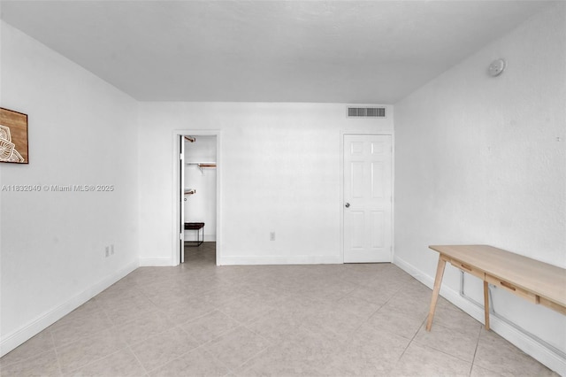 10350 W Bay Harbor Dr Unit 8F, Bay Harbor Islands, FL 33154 - unfurnished room featuring a smoke detector and light tile patterned floors