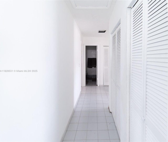 13250 SW 29th Ter, Miami, FL 33175 - corridor with light tile patterned floors