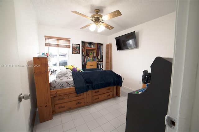 13250 SW 29th Ter, Miami, FL 33175 - bedroom with a ceiling fan, light tile patterned flooring, and a textured ceiling