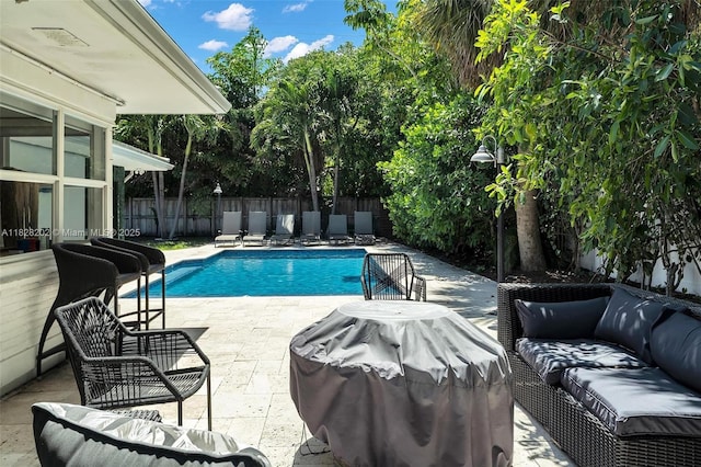 3210 Dover Rd, Pompano Beach, FL 33062 - view of swimming pool featuring a fenced backyard, a patio, outdoor lounge area, and area for grilling