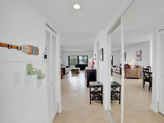 245 SE 10th St Unit 4B, Deerfield Beach, FL 33441 - corridor featuring light tile patterned floors