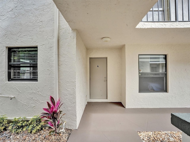 245 SE 10th St Unit 4B, Deerfield Beach, FL 33441 - property entrance with stucco siding