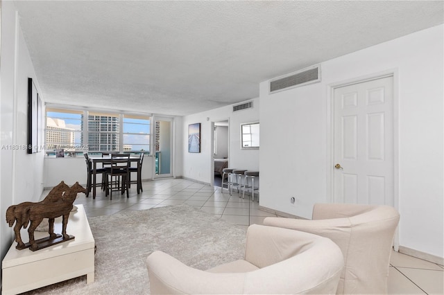 6770 Indian Creek Dr Unit 7A, Miami Beach, FL 33141 - living room with tile patterned flooring and a textured ceiling