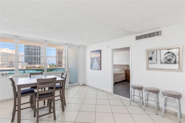 6770 Indian Creek Dr Unit 7A, Miami Beach, FL 33141 - dining area with a textured ceiling and a city view