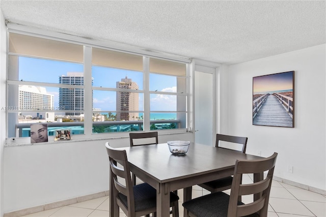6770 Indian Creek Dr Unit 7A, Miami Beach, FL 33141 - dining area with a textured ceiling, light tile patterned floors, and a view of city