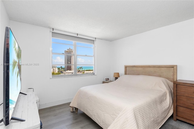 6770 Indian Creek Dr Unit 7A, Miami Beach, FL 33141 - bedroom with wood finished floors and baseboards