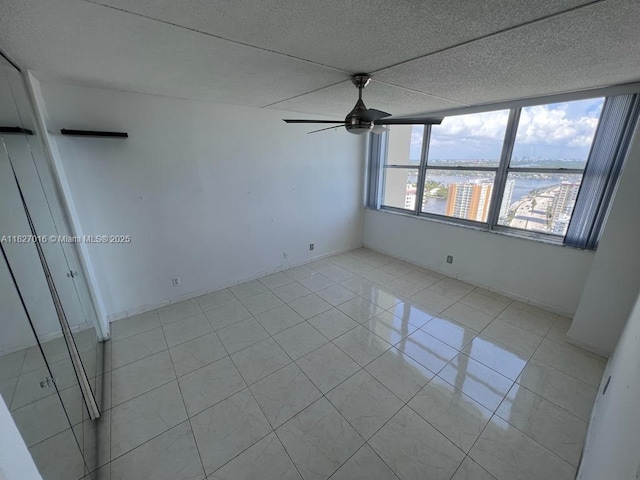 2101 S Ocean Dr Unit 2603, Hollywood, FL 33019 - spare room with a ceiling fan and light tile patterned floors