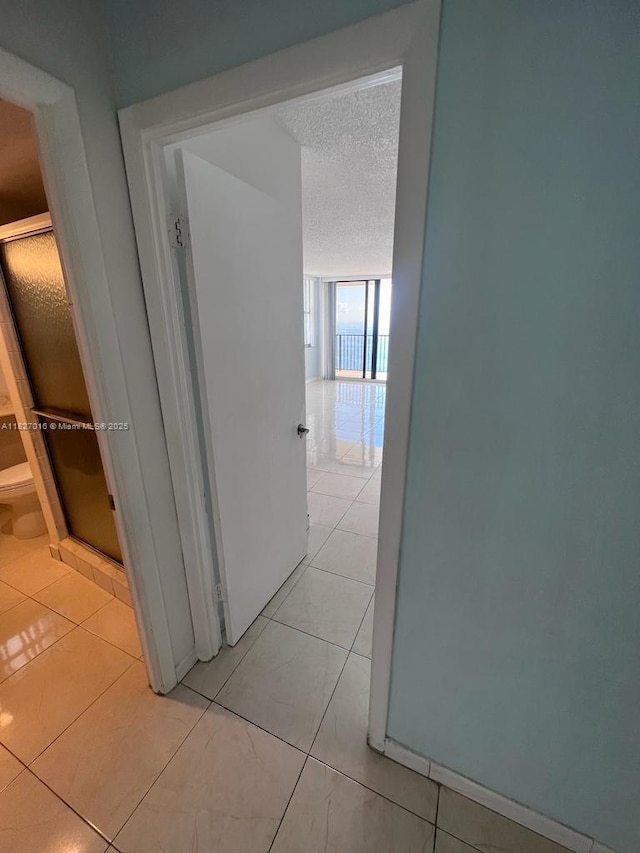 2101 S Ocean Dr Unit 2603, Hollywood, FL 33019 - hall with a textured ceiling and light tile patterned floors