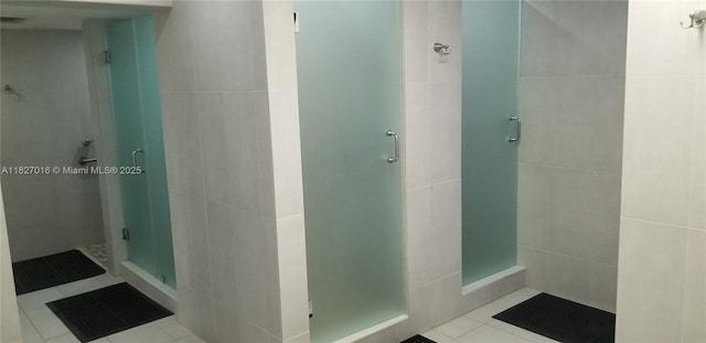 2101 S Ocean Dr Unit 2603, Hollywood, FL 33019 - full bath with a stall shower, tile walls, and tile patterned flooring
