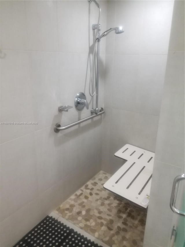 2101 S Ocean Dr Unit 2603, Hollywood, FL 33019 - bathroom with a shower stall, tile walls, and tile patterned flooring