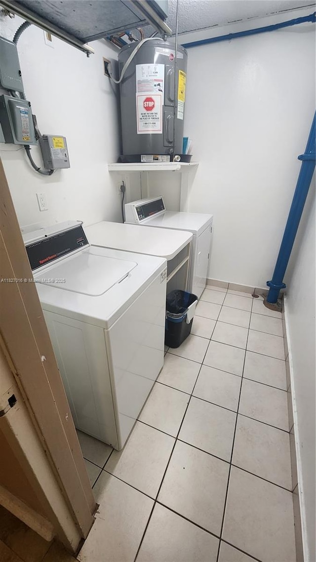 2101 S Ocean Dr Unit 2603, Hollywood, FL 33019 - laundry room with washer and clothes dryer, light tile patterned floors, and water heater
