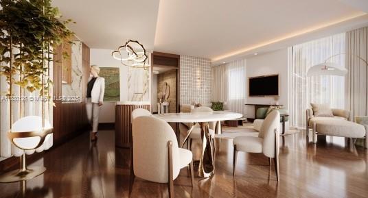 10295 Collins Ave Unit 1114, Bal Harbour, FL 33154 - dining area with wood finished floors and a chandelier