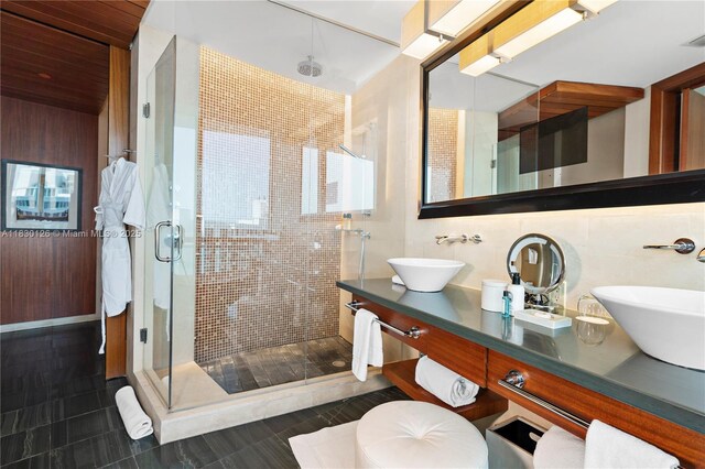 10295 Collins Ave Unit 1114, Bal Harbour, FL 33154 - full bathroom with a shower stall, double vanity, and tile patterned flooring