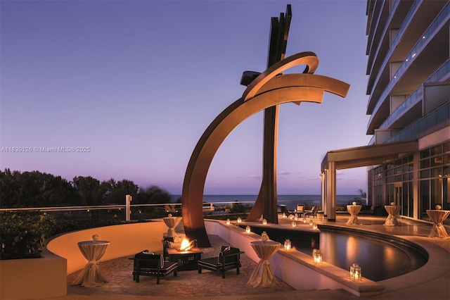10295 Collins Ave Unit 1114, Bal Harbour, FL 33154 - view of patio featuring a fire pit