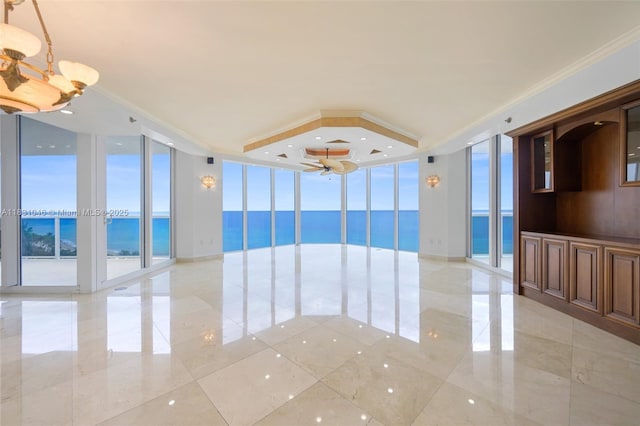 19111 Collins Ave Unit 801, Sunny Isles Beach, FL 33160 - spare room with expansive windows, a water view, and a chandelier