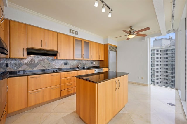 19111 Collins Ave Unit 801, Sunny Isles Beach, FL 33160 - kitchen with under cabinet range hood, dark countertops, a ceiling fan, decorative backsplash, and black electric cooktop