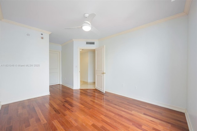 19111 Collins Ave Unit 801, Sunny Isles Beach, FL 33160 - spare room featuring wood finished floors, a ceiling fan, and crown molding