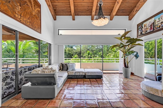 3520 Rockerman Rd, Miami, FL 33133 - living room featuring a wooden ceiling with exposed beams, plenty of natural light, and a chandelier