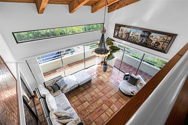 3520 Rockerman Rd, Miami, FL 33133 - living room featuring beamed ceiling, a towering ceiling, and tile patterned flooring