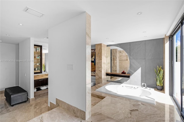 3520 Rockerman Rd, Miami, FL 33133 - full bathroom featuring a bath, marble tiled flooring, vanity, recessed lighting, and tile walls
