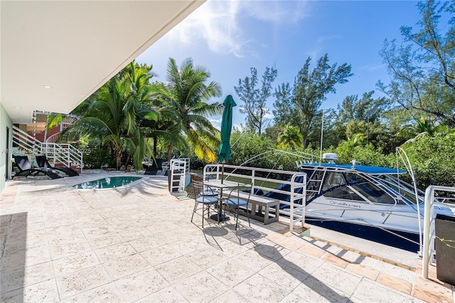 3520 Rockerman Rd, Miami, FL 33133 - view of patio / terrace featuring an outdoor pool
