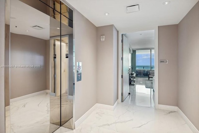 15701 Collins Ave Unit 2902, Sunny Isles Beach, FL 33160 - hallway featuring marble tiled flooring and recessed lighting