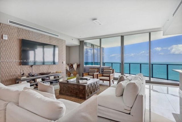 15701 Collins Ave Unit 2902, Sunny Isles Beach, FL 33160 - living room featuring a water view, expansive windows, and tile patterned flooring