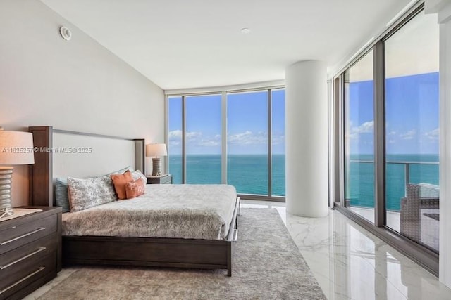 15701 Collins Ave Unit 2902, Sunny Isles Beach, FL 33160 - bedroom featuring a water view, a wall of windows, and light marble finish flooring