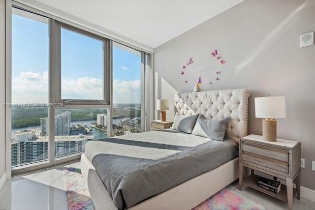 15701 Collins Ave Unit 2902, Sunny Isles Beach, FL 33160 - bedroom with multiple windows, a wall of windows, and a water view