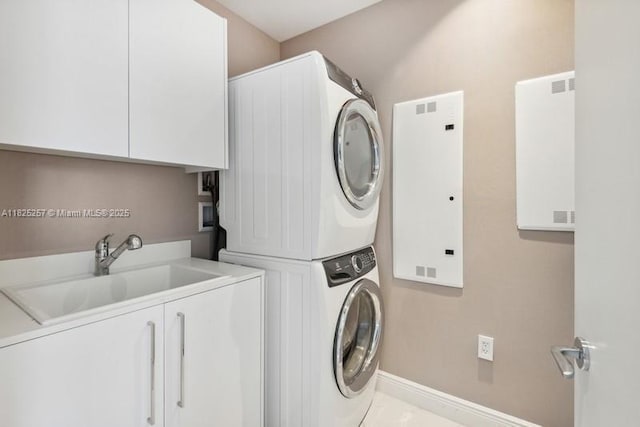15701 Collins Ave Unit 2902, Sunny Isles Beach, FL 33160 - laundry area with estacked washer and dryer and cabinet space