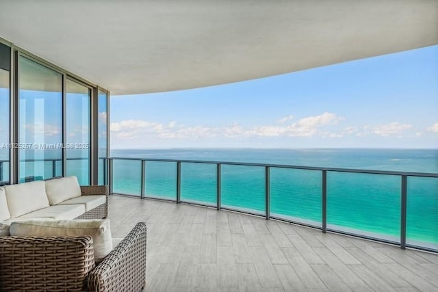 15701 Collins Ave Unit 2902, Sunny Isles Beach, FL 33160 - balcony with a water view and an outdoor hangout area