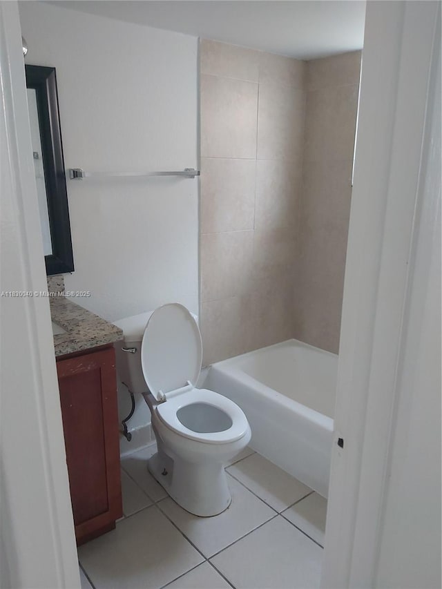 241 SE 9th Ave Unit 103, Pompano Beach, FL 33060 - bathroom featuring vanity, tile patterned flooring, and washtub / shower combination