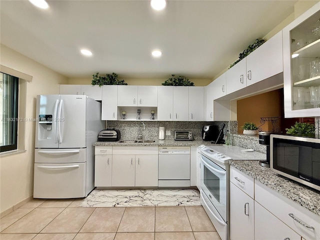 318 Lakeview Dr Unit 203, Weston, FL 33326 - kitchen with white appliances, white cabinets, tasteful backsplash, open shelves, and recessed lighting