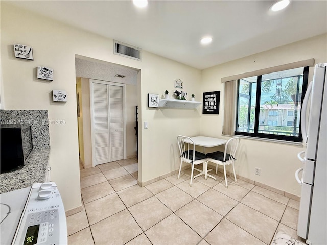 318 Lakeview Dr Unit 203, Weston, FL 33326 - dining room with light tile patterned floors and recessed lighting