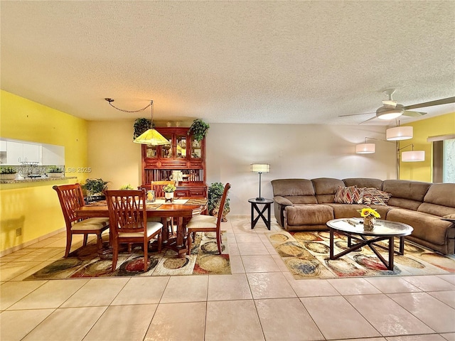318 Lakeview Dr Unit 203, Weston, FL 33326 - dining room with tile patterned floors, a textured ceiling, and a ceiling fan