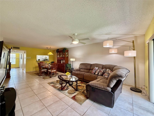 318 Lakeview Dr Unit 203, Weston, FL 33326 - living room featuring light tile patterned flooring, a textured ceiling, and a ceiling fan