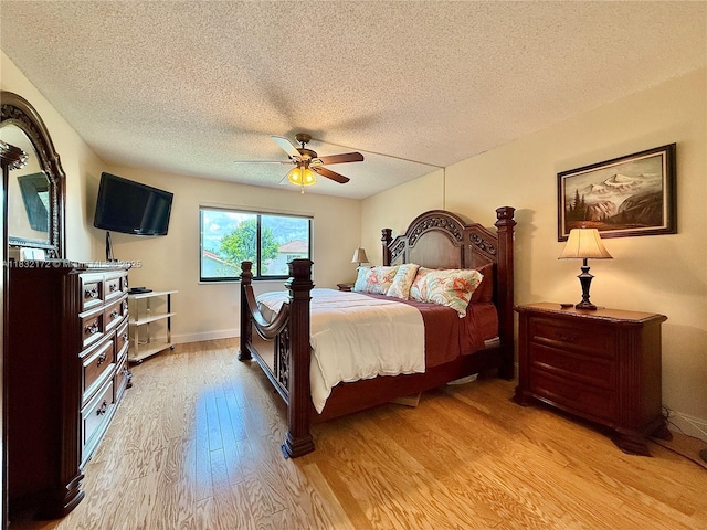 318 Lakeview Dr Unit 203, Weston, FL 33326 - bedroom featuring light wood-style flooring, a textured ceiling, and ceiling fan
