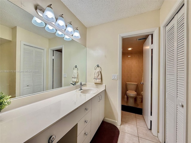318 Lakeview Dr Unit 203, Weston, FL 33326 - bathroom with a closet, vanity, tile patterned floors, and a textured ceiling