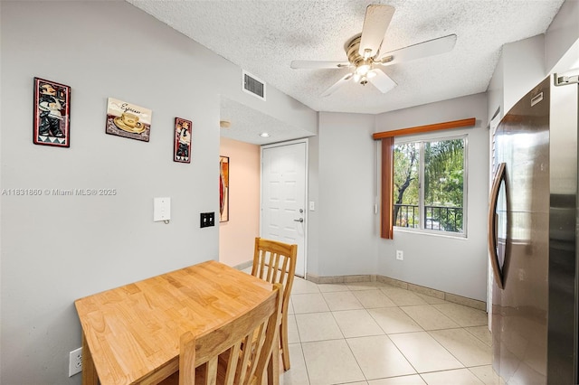 1601 SW 128th Ter Unit 209A, Pembroke Pines, FL 33027 - dining room featuring a textured ceiling, ceiling fan, and light tile patterned floors