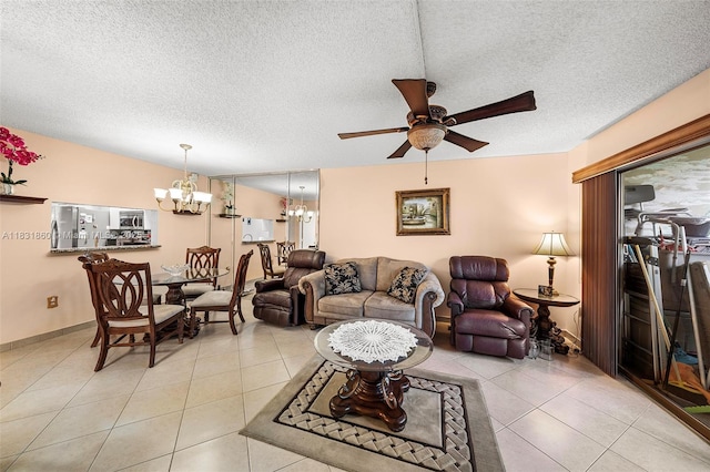 1601 SW 128th Ter Unit 209A, Pembroke Pines, FL 33027 - living area featuring a chandelier, a ceiling fan, a textured ceiling, and light tile patterned flooring