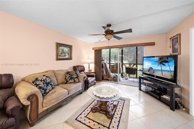 1601 SW 128th Ter Unit 209A, Pembroke Pines, FL 33027 - living area featuring ceiling fan, light tile patterned flooring, and a textured ceiling