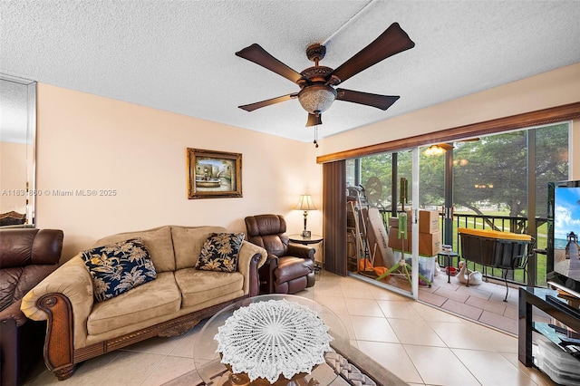 1601 SW 128th Ter Unit 209A, Pembroke Pines, FL 33027 - living room featuring a ceiling fan, light tile patterned floors, and a textured ceiling