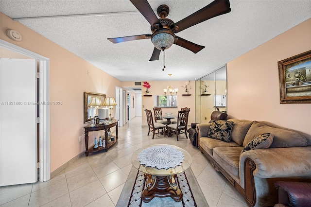 1601 SW 128th Ter Unit 209A, Pembroke Pines, FL 33027 - living area with a textured ceiling, a ceiling fan, light tile patterned floors, and a chandelier
