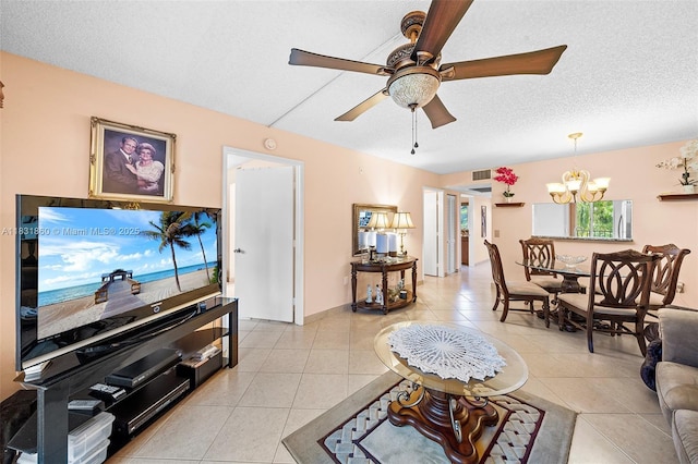 1601 SW 128th Ter Unit 209A, Pembroke Pines, FL 33027 - living room with a chandelier, light tile patterned flooring, ceiling fan, and a textured ceiling